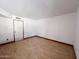 Spacious living room featuring wood-look floors and neutral wall color at 23833 N 36Th Dr, Glendale, AZ 85310