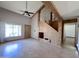Spacious living room with high ceilings, ceiling fan, wood floors and staircase at 23833 N 36Th Dr, Glendale, AZ 85310