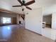 Open living room featuring wood floors, high ceilings and access to the kitchen at 23833 N 36Th Dr, Glendale, AZ 85310