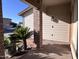 Inviting covered front porch with brick columns, mature landscaping, and a peaceful ambiance at 23833 N 36Th Dr, Glendale, AZ 85310