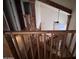 Spacious staircase, enhanced by wooden accents, offers views of the downstairs living area and tall ceilings at 23833 N 36Th Dr, Glendale, AZ 85310