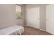 Bedroom with natural light, carpet flooring, and generous closet space for comfortable living at 26272 N 73Rd Dr, Peoria, AZ 85383