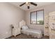 Well-lit bedroom with carpet, a single bed, and a window offering natural light at 26272 N 73Rd Dr, Peoria, AZ 85383