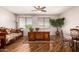 Inviting home office with wood floors, large desk, and good light, perfect for working from home at 26272 N 73Rd Dr, Peoria, AZ 85383