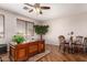 Inviting home office with wood floors, and good light, perfect for working from home at 26272 N 73Rd Dr, Peoria, AZ 85383