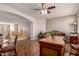 Spacious office area with wood floors, good light, and adjacent staircase at 26272 N 73Rd Dr, Peoria, AZ 85383