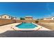 This backyard has a concrete pool with a stone border and landscaping at 26272 N 73Rd Dr, Peoria, AZ 85383