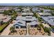 Expansive aerial view of a luxury home with manicured landscaping and a courtyard in a well-planned community at 2630 E Lovebird Ln, Gilbert, AZ 85297