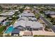 Grand estate featuring a luxurious pool, beautiful landscaping, and a covered outdoor living area for relaxation and entertainment at 2630 E Lovebird Ln, Gilbert, AZ 85297