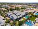 Aerial view showcasing a pristine pool, manicured lawn, modern outdoor kitchen, and covered area, ideal for outdoor living at 2630 E Lovebird Ln, Gilbert, AZ 85297
