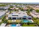 Expansive estate aerial view showcasing a private pool, lush landscaping, and a covered outdoor living area, perfect for entertaining at 2630 E Lovebird Ln, Gilbert, AZ 85297