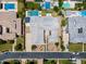 Stunning aerial shot of an estate showcasing meticulously landscaped grounds, a large pool, and multiple outdoor entertaining spaces at 2630 E Lovebird Ln, Gilbert, AZ 85297