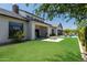 Beautiful backyard with a covered patio, a cozy fire pit, and views of the sparkling pool area at 2630 E Lovebird Ln, Gilbert, AZ 85297