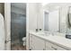 Clean white bathroom featuring modern fixtures, a well-lit mirror, and a tiled shower at 2630 E Lovebird Ln, Gilbert, AZ 85297