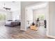 Spacious bedroom adjacent to home gym, featuring wood floors, a ceiling fan, and plenty of natural light at 2630 E Lovebird Ln, Gilbert, AZ 85297