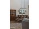 Dining area with rustic furniture, chandelier, and built-in hutch in a neutral color palette at 2630 E Lovebird Ln, Gilbert, AZ 85297