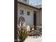 Exterior shot features a charming water fountain, complemented by lush landscaping and seating at 2630 E Lovebird Ln, Gilbert, AZ 85297