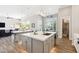Bright kitchen featuring a large island with seating and stainless steel appliances at 2630 E Lovebird Ln, Gilbert, AZ 85297