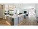 Open concept kitchen with an island, stainless appliances, and views to the living area at 2630 E Lovebird Ln, Gilbert, AZ 85297