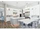 Bright kitchen featuring gray cabinets, an island, and stainless steel appliances at 2630 E Lovebird Ln, Gilbert, AZ 85297