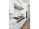 Close up of stovetop with stainless steel range hood and light gray subway tile backsplash at 2630 E Lovebird Ln, Gilbert, AZ 85297