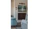 Close up of fireplace in the living room with neutral couches and a painting above the fireplace at 2630 E Lovebird Ln, Gilbert, AZ 85297
