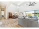 Open floor plan showcasing living room and dining area with high ceilings and sliding glass door at 2630 E Lovebird Ln, Gilbert, AZ 85297