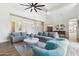 Bright living room featuring hardwood floors, high ceilings, neutral walls, and comfortable seating at 2630 E Lovebird Ln, Gilbert, AZ 85297