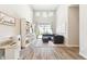 Bright living room with built-in bookcase, modern fan, and large sliding glass doors to the yard at 2630 E Lovebird Ln, Gilbert, AZ 85297