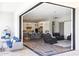 Indoor/outdoor living space featuring a modern kitchen, living room, and outdoor patio at 2630 E Lovebird Ln, Gilbert, AZ 85297