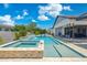 Backyard pool area with spa, water feature, and ample seating under blue skies at 2630 E Lovebird Ln, Gilbert, AZ 85297