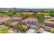 Aerial view of a home in a community with nearby athletic fields and tennis courts at 27053 N 172Nd Ln, Surprise, AZ 85387
