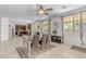 Bright dining room with a wooden table, chairs, bench, and adjacent kitchen space at 27053 N 172Nd Ln, Surprise, AZ 85387