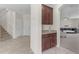Hallway with access to stairs, storage, and open living spaces at 27053 N 172Nd Ln, Surprise, AZ 85387
