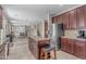 Well-equipped kitchen featuring stainless steel appliances, granite countertops, a kitchen island, and ample cabinetry at 27053 N 172Nd Ln, Surprise, AZ 85387