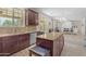 Open concept kitchen with stainless steel appliances, granite countertops, kitchen island and adjoined dining room at 27053 N 172Nd Ln, Surprise, AZ 85387