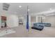 Upstairs living room featuring plush furniture and lots of space for entertaining guests or relaxing at 27053 N 172Nd Ln, Surprise, AZ 85387