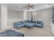 Upstairs living room featuring plush sectional sofa, and natural light from an exterior window at 27053 N 172Nd Ln, Surprise, AZ 85387