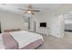 Large main bedroom with neutral walls, ceiling fan, and an ensuite bathroom at 27053 N 172Nd Ln, Surprise, AZ 85387