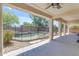 Covered patio with an open view of the fenced pool area and desert landscaping at 27053 N 172Nd Ln, Surprise, AZ 85387