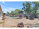 Backyard featuring a fenced pool area, desert landscaping, and comfortable patio seating at 27053 N 172Nd Ln, Surprise, AZ 85387