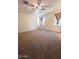 Comfortable bedroom showcasing plush carpet, and two windows providing ample light at 29906 W Whitton Ave, Buckeye, AZ 85396