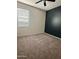 Comfortable bedroom featuring plush carpeting, a window, and a modern ceiling fan at 29906 W Whitton Ave, Buckeye, AZ 85396