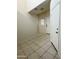 Entryway with neutral tiled floors and staircase to the side, a front door and natural light at 29906 W Whitton Ave, Buckeye, AZ 85396