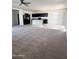 View of an open floor plan between the kitchen and living room, with natural light from the windows at 29906 W Whitton Ave, Buckeye, AZ 85396