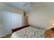 Neutral bedroom with ceiling fan and closet with sliding doors at 3128 W Belle Ave, San Tan Valley, AZ 85144