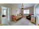 Relaxing bedroom featuring a daybed and a comfortable chair, creating a welcoming space at 3128 W Belle Ave, San Tan Valley, AZ 85144