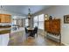 Charming dining area with tile floors and a view into the kitchen and eating area at 3128 W Belle Ave, San Tan Valley, AZ 85144