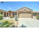 Charming single-Gathering home with a two-car garage, desert landscaping and front yard at 3128 W Belle Ave, San Tan Valley, AZ 85144