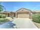 Charming single-Gathering home with a two-car garage, desert landscaping and front yard at 3128 W Belle Ave, San Tan Valley, AZ 85144